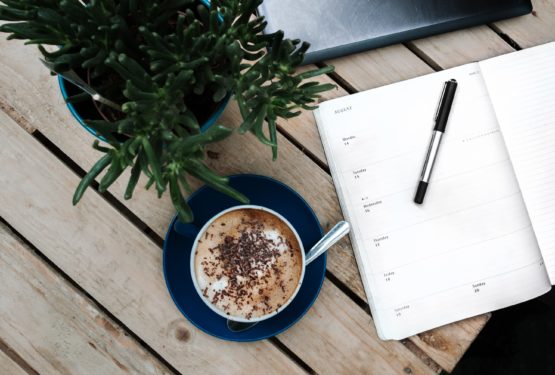 Coffee and diary on a table