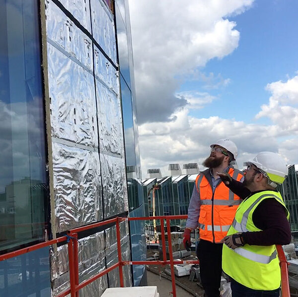 Men viewing external insulation