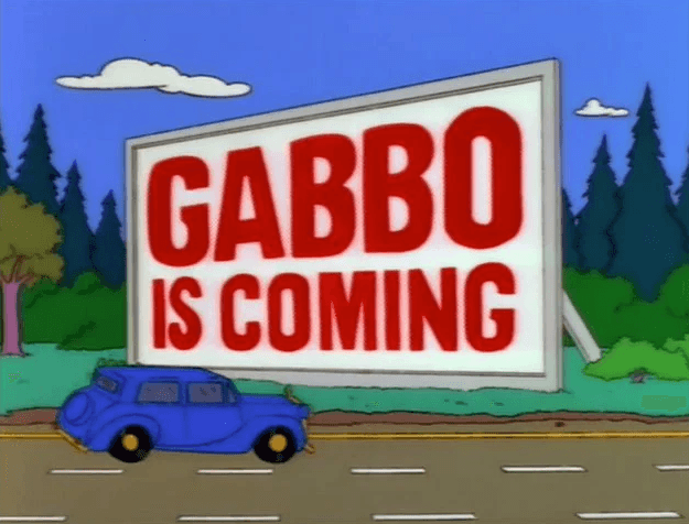 Mr Burn's car drives past a Gabbo billboard - The Simpsons, Krusty Gets Kancelled