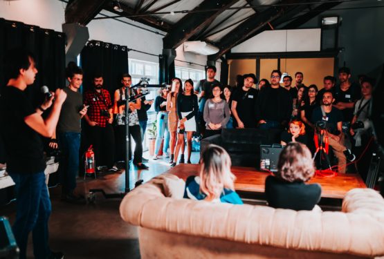 A group of people standing inside a room