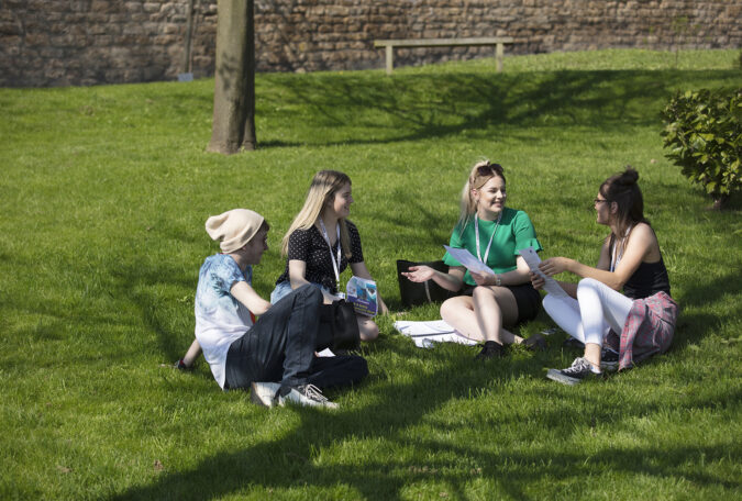 Students sat in the garden at Lincoln College