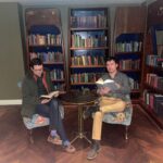 Team members sat reading in library