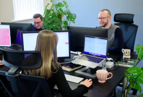 Team working on computers at Carrington agency
