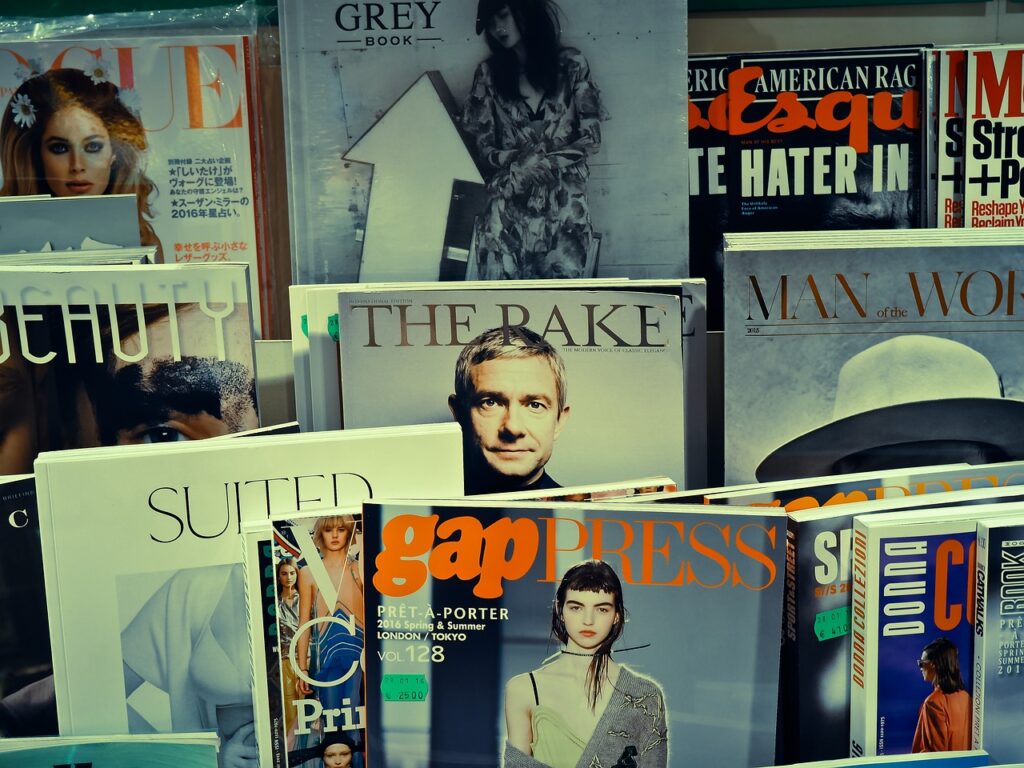 Magazines in a rack in a paper shop