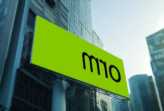 Neon ORM green sign on skyscraper