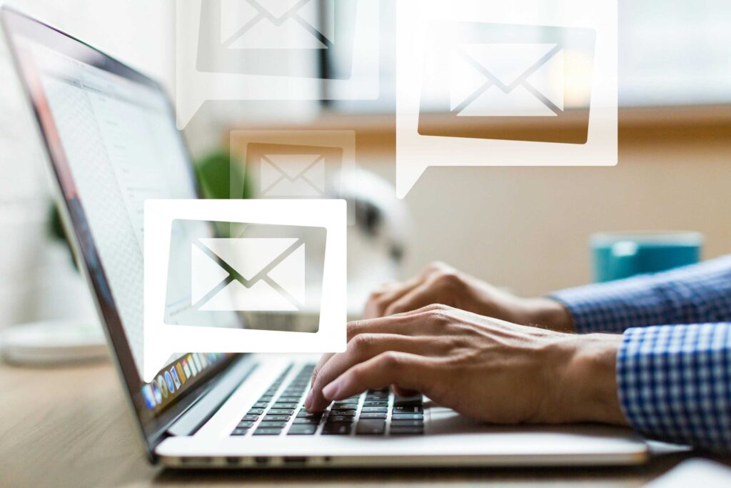 Email marketing icons in a Carrington logo over a laptop. Image from Pexels
